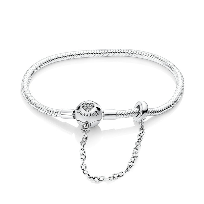 Silver bracelet with a clasp on a white background