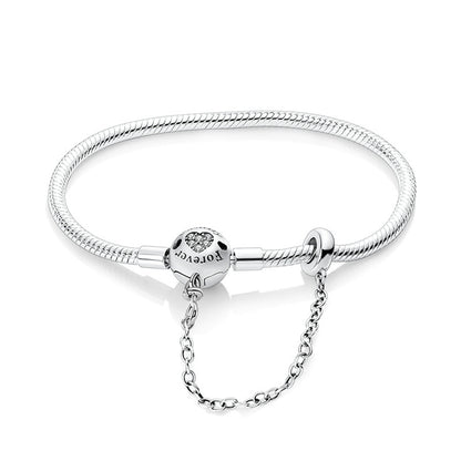Silver bracelet with a clasp on a white background